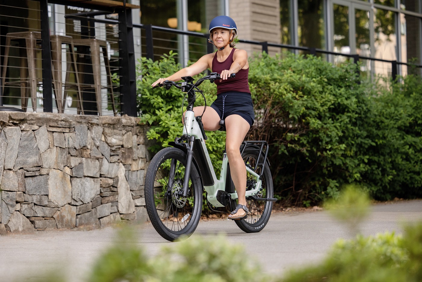 A rider on a Pedego Ridge Rider 2 e-bike on a neighborhood street