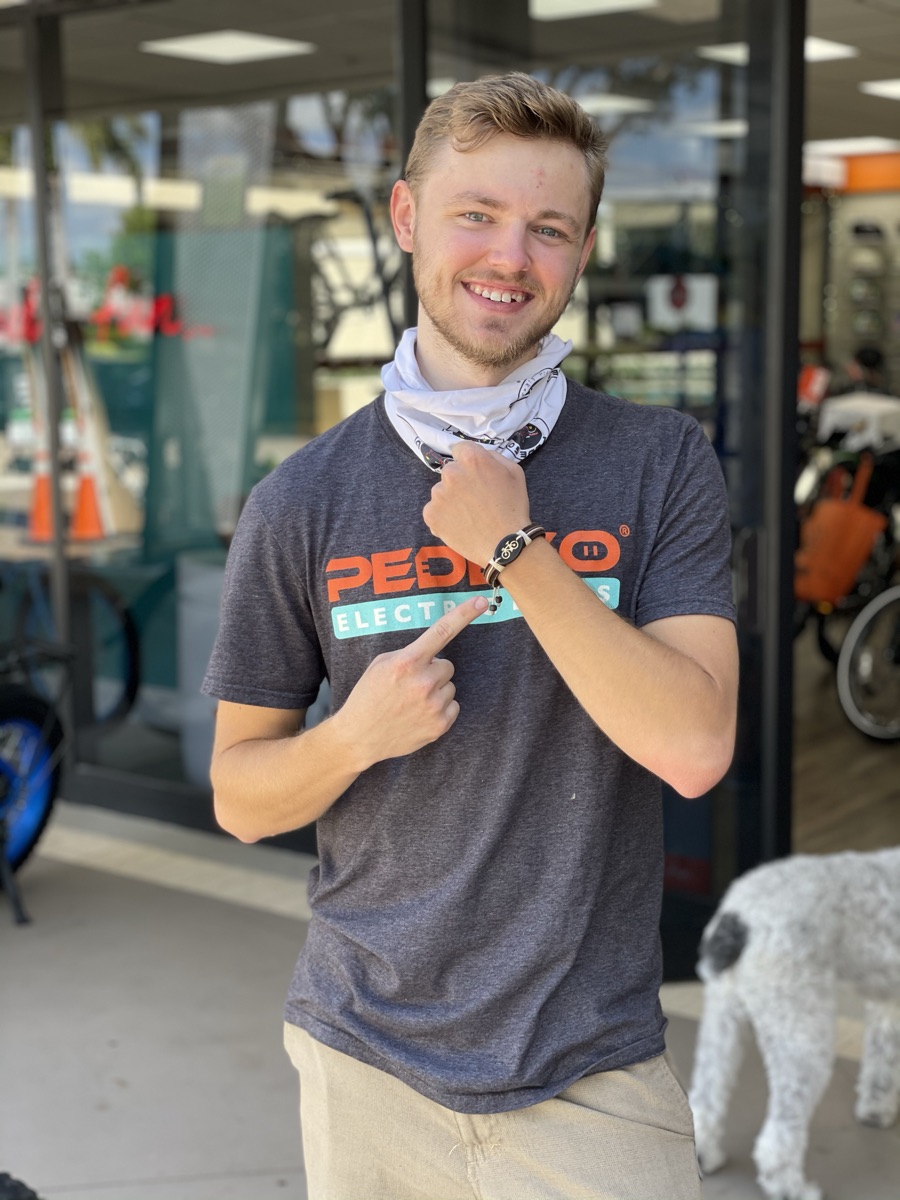 Kyle outside the shop in a Pedego shirt